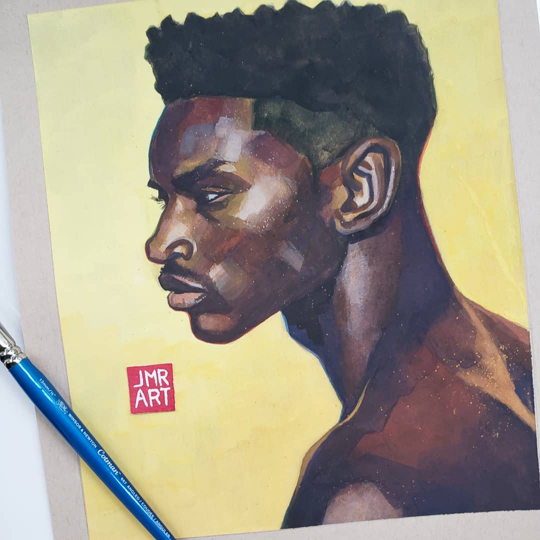 Portrait of a young man in profile with a colorful abstract background.