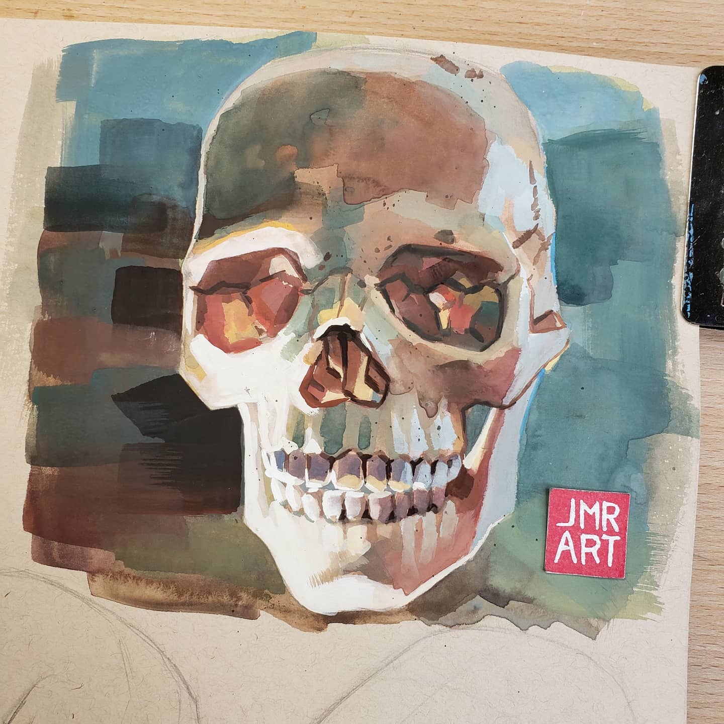 Colorful watercolor skull painting by JMR Art on textured paper.